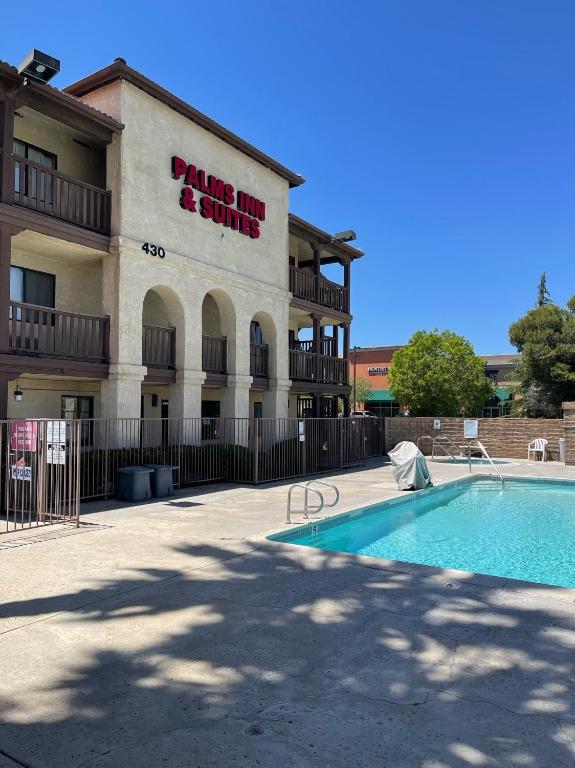 Palms Inn & Suites - Exterior with Pool-2