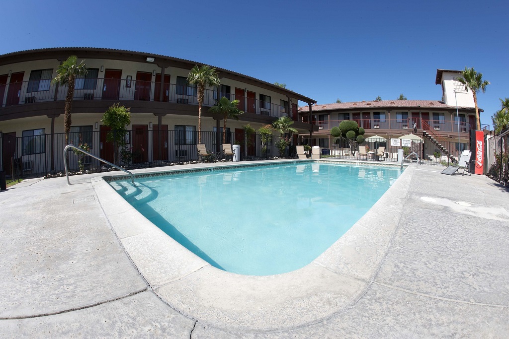 Palms Inn & Suites - Exterior with Pool-1